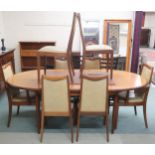 A mid 20th century G Plan Fresco teak dining table and eight chairs, extending table with oval top