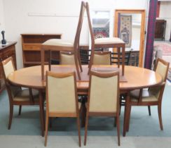 A mid 20th century G Plan Fresco teak dining table and eight chairs, extending table with oval top