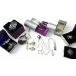 A silver bangle with a pattern of matt & shiny squares, with matching earrings and a pendant, a