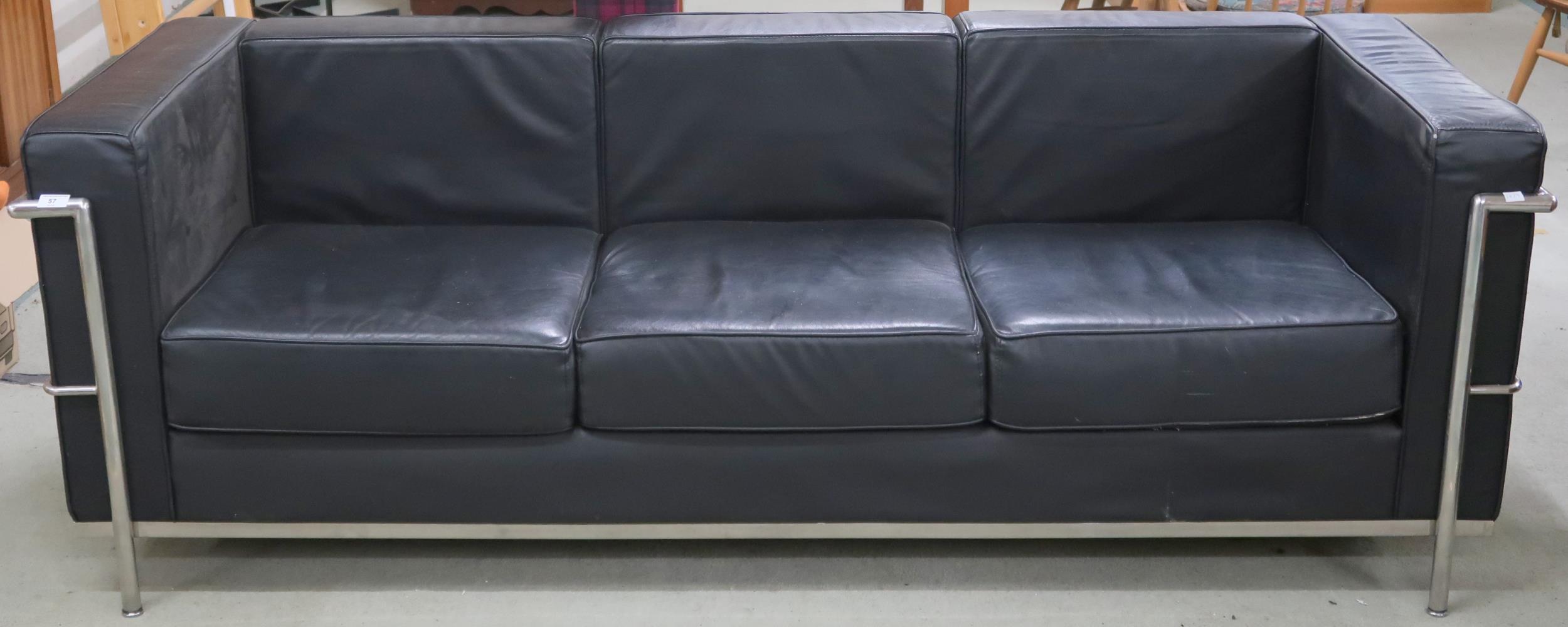 A 20th century after Le Corbusier with black vinyl upholstery on chromed tubular frame, 70cm high