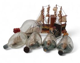 A collection of ships in bottles, a pair of ship bookends etc Condition Report:Available upon