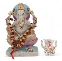 A painted alabaster model of Ganesh, 32cm high, and a silver coated example by Lorodana Sandona, 9cm