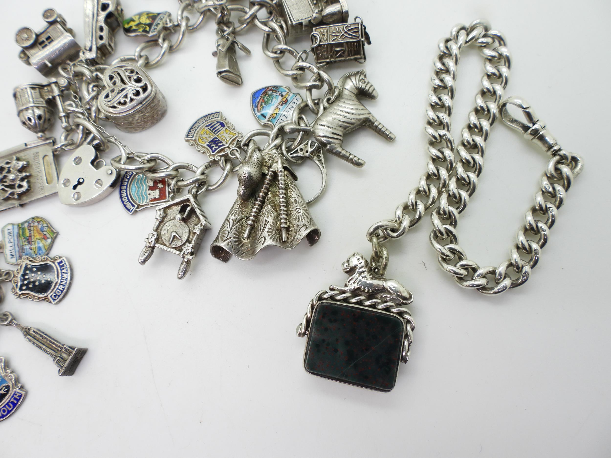 Two silver and white metal charm bracelets together with a silver fob chain bracelet with attached - Image 3 of 3