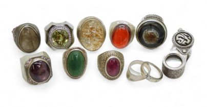A collection of silver and white metal rings, to include set with ruby, rutilated quartz and agate