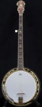 A Barnes & Mullins 22 fret 5 string Jo' the Troubadour banjo with a burl maple resonator paired with
