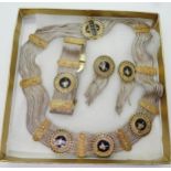 A silver necklace, bracelet and earring set, with gold plated and enamelled elements with the