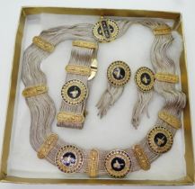 A silver necklace, bracelet and earring set, with gold plated and enamelled elements with the