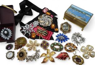 A collection of vintage costume brooches to include Czech glass examples, a statement necklace