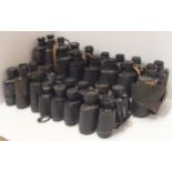 A large quantity of vintage binoculars, with manufacturers including Frank-Nipole, Regent,