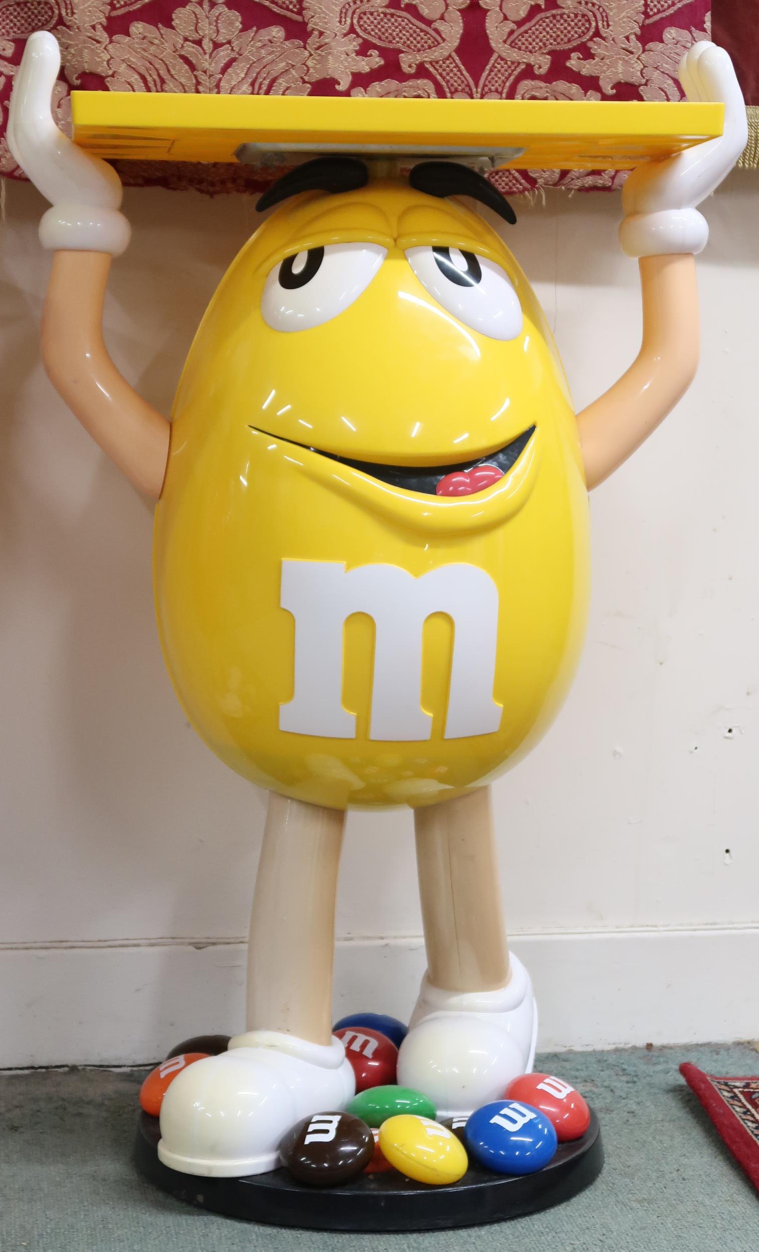 A lot comprising mixed pair of Mars M&M red and yellow advertising standees holding fixed serving - Image 2 of 3