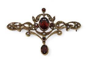 A 9ct gold garnet and pearl Art Nouveau style brooch, length 5cm, weight 5.5gms Condition Report: