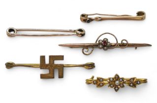 Five gold and yellow metal brooches to include a 14ct gold Swastika brooch weight 2.2gms, and the