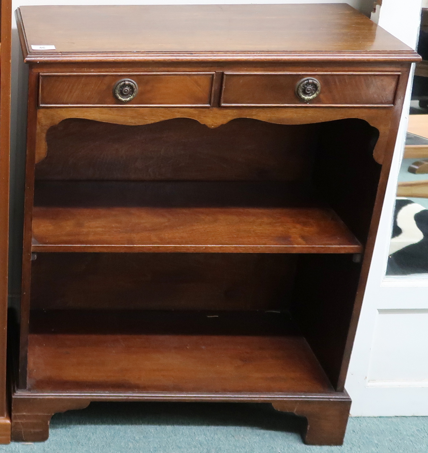 An early 20th century mahogany two drawer open bookcase, 81cm high x 64cm wide x 29cm deep