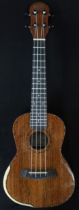 A Barns & Mullins ukulele model BMUK5C with a fitted banjo case Condition Report:Available upon