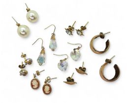 A collection of gold and yellow metal earrings to include creole, bi colour knot etc, weight all