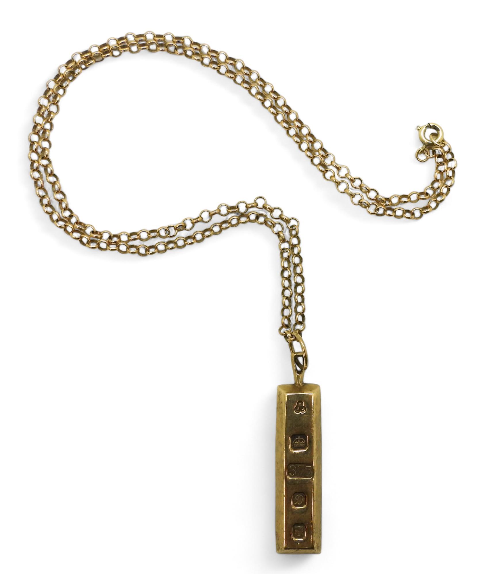 A 9ct gold ingot pendant and 52cm 9ct chain, weight together 22.8gms Condition Report:Available upon