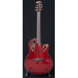 An Ovation Celebrity electro acoustic six string guitar model CE44-RR in red, serial number