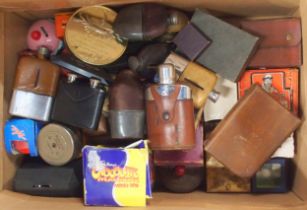 A large mixed lot, comprising money banks, boxed safety razors, cigarette lighters, hipflasks etc.