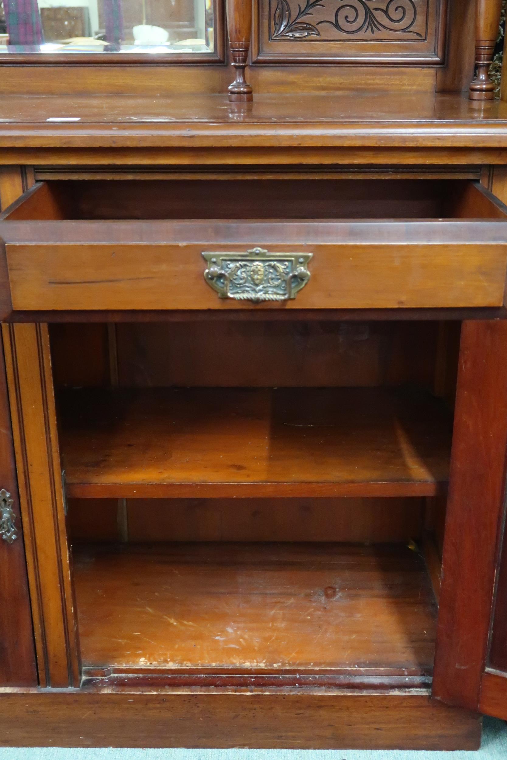 A late Victorian mahogany mirror back sideboard with carved surmount over bevelled mirror panes on - Image 3 of 4