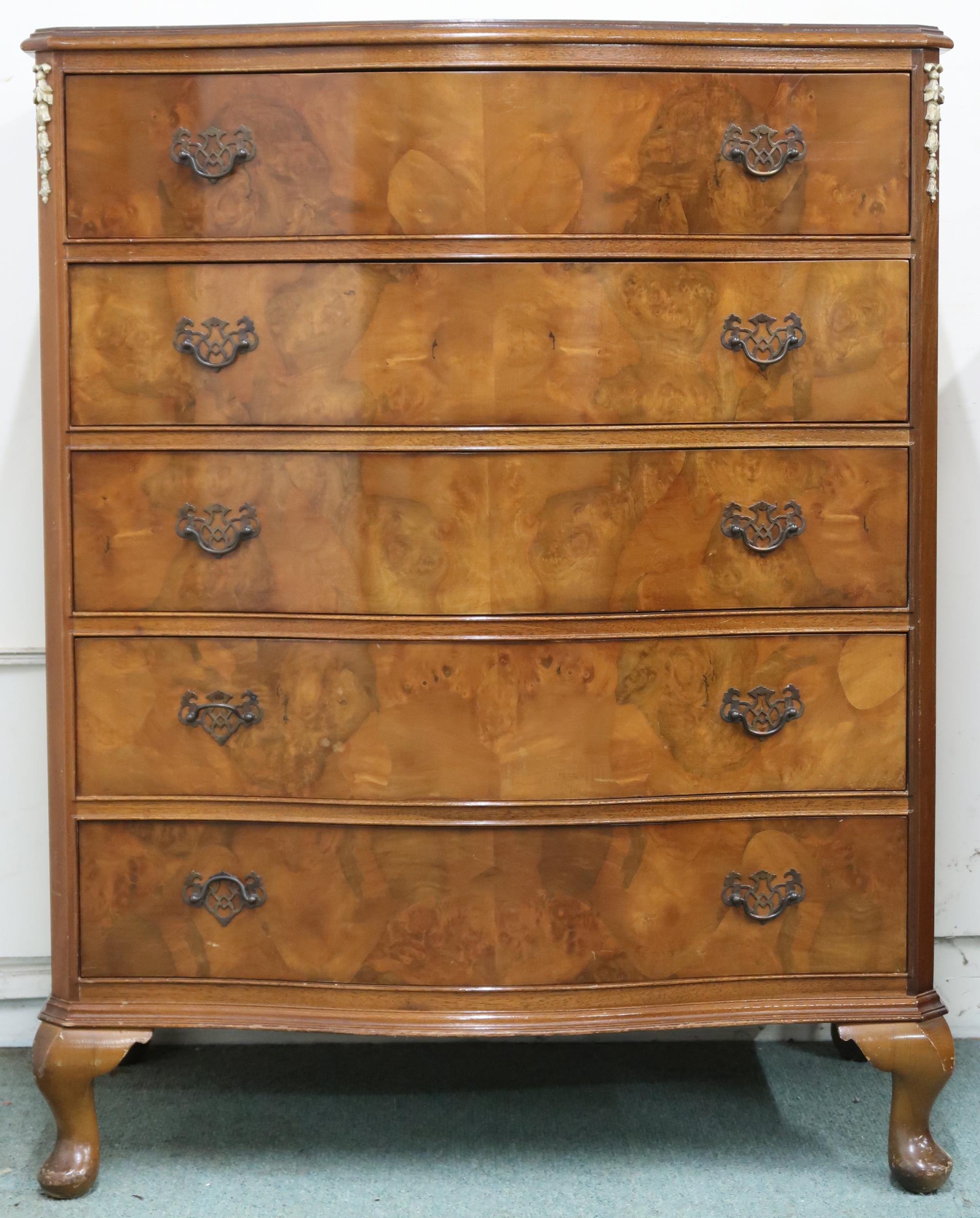 A 20th century walnut veneered serpentine front five drawer chest on cabriole supports, 102cm high x