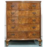 A 20th century walnut veneered serpentine front five drawer chest on cabriole supports, 102cm high x