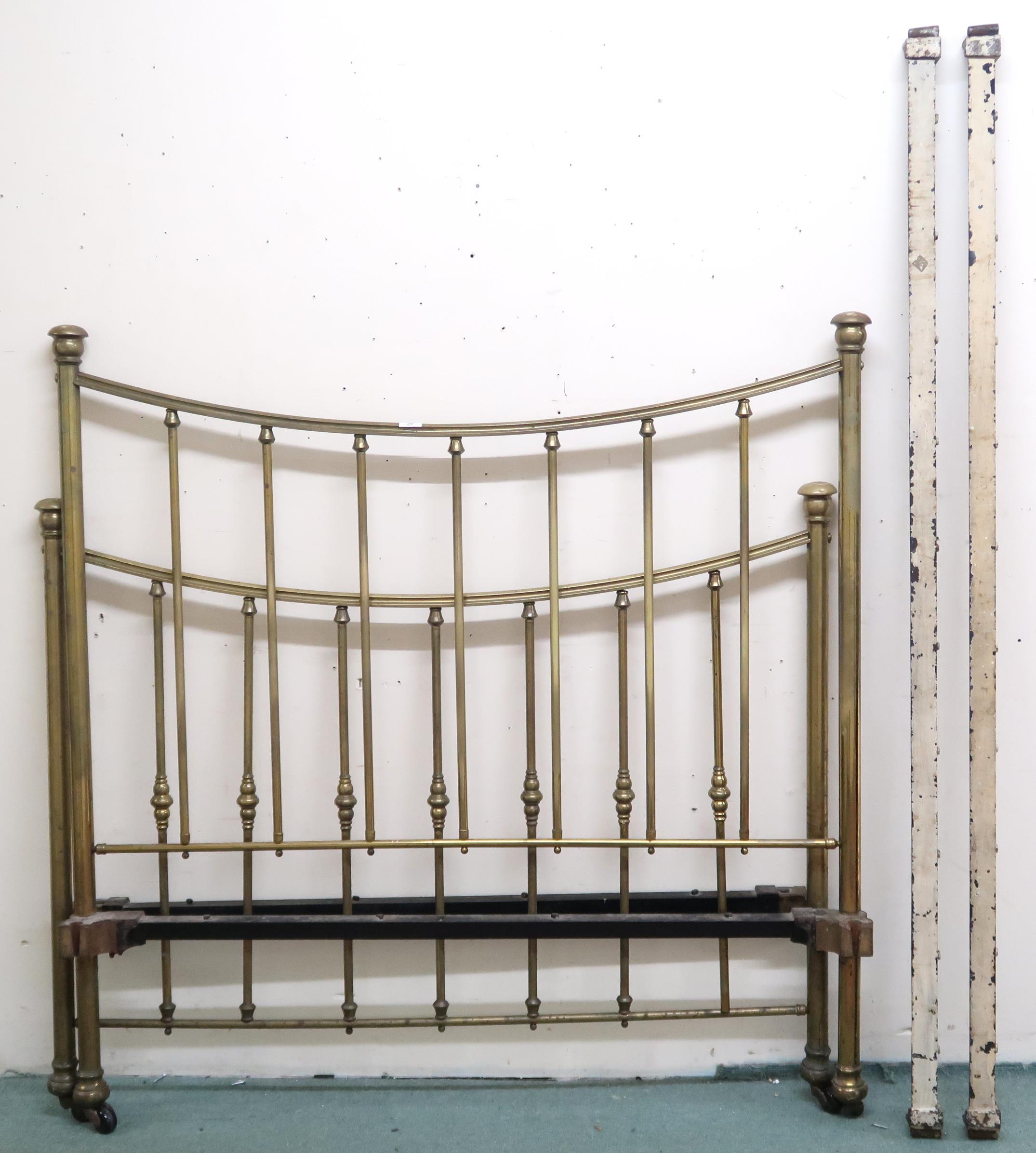 A Victorian brass framed tester sized bed frame with cast iron side rails, 141cm high x 140cm wide x