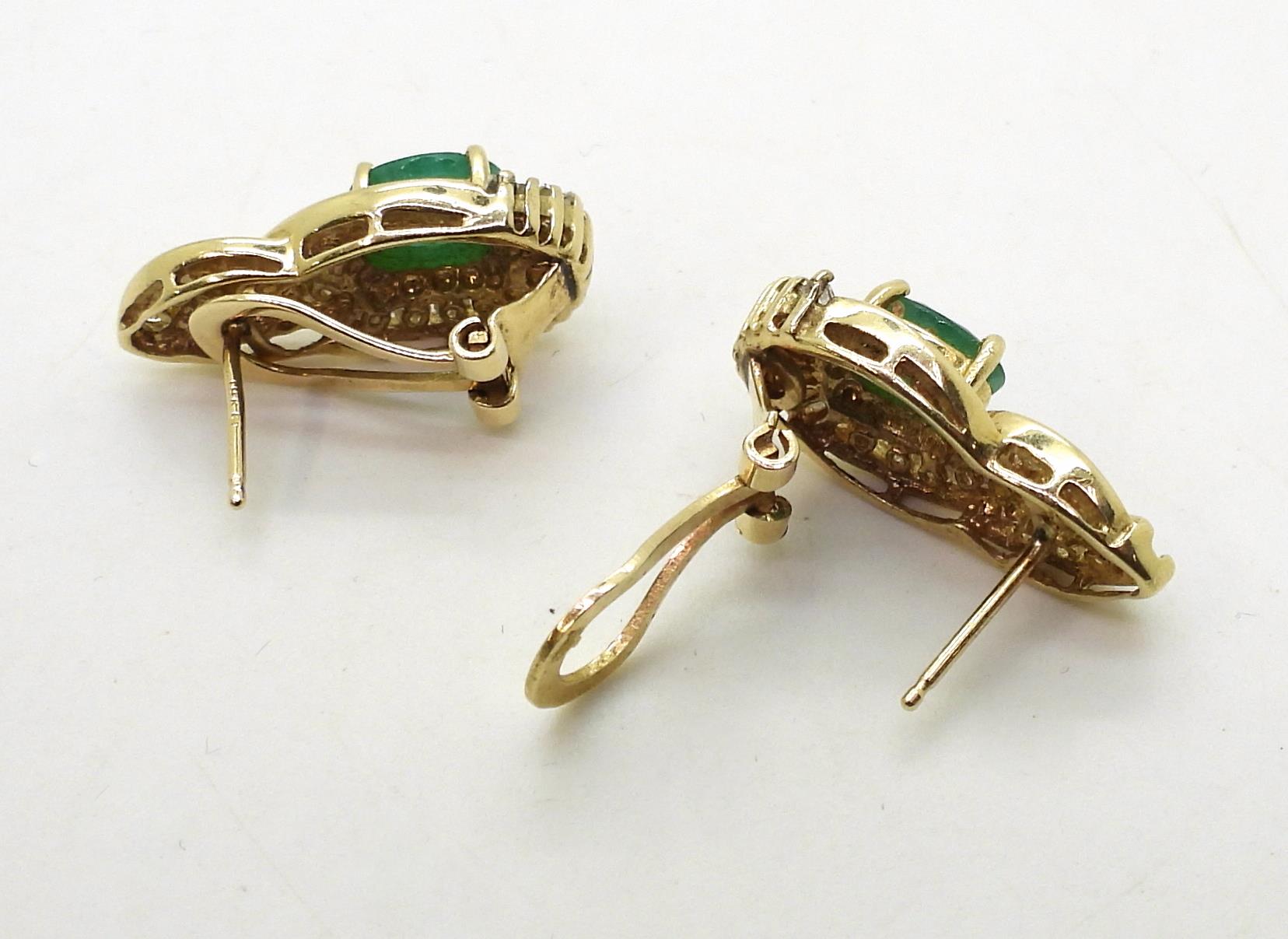 A pair of 14k gold emerald and diamond earrings set with estimated approx 0.50cts of brilliant and - Image 3 of 3