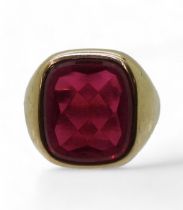 A 9ct gold red glass gem set signet ring, size U approx, weight 9.6gms Condition Report:Available