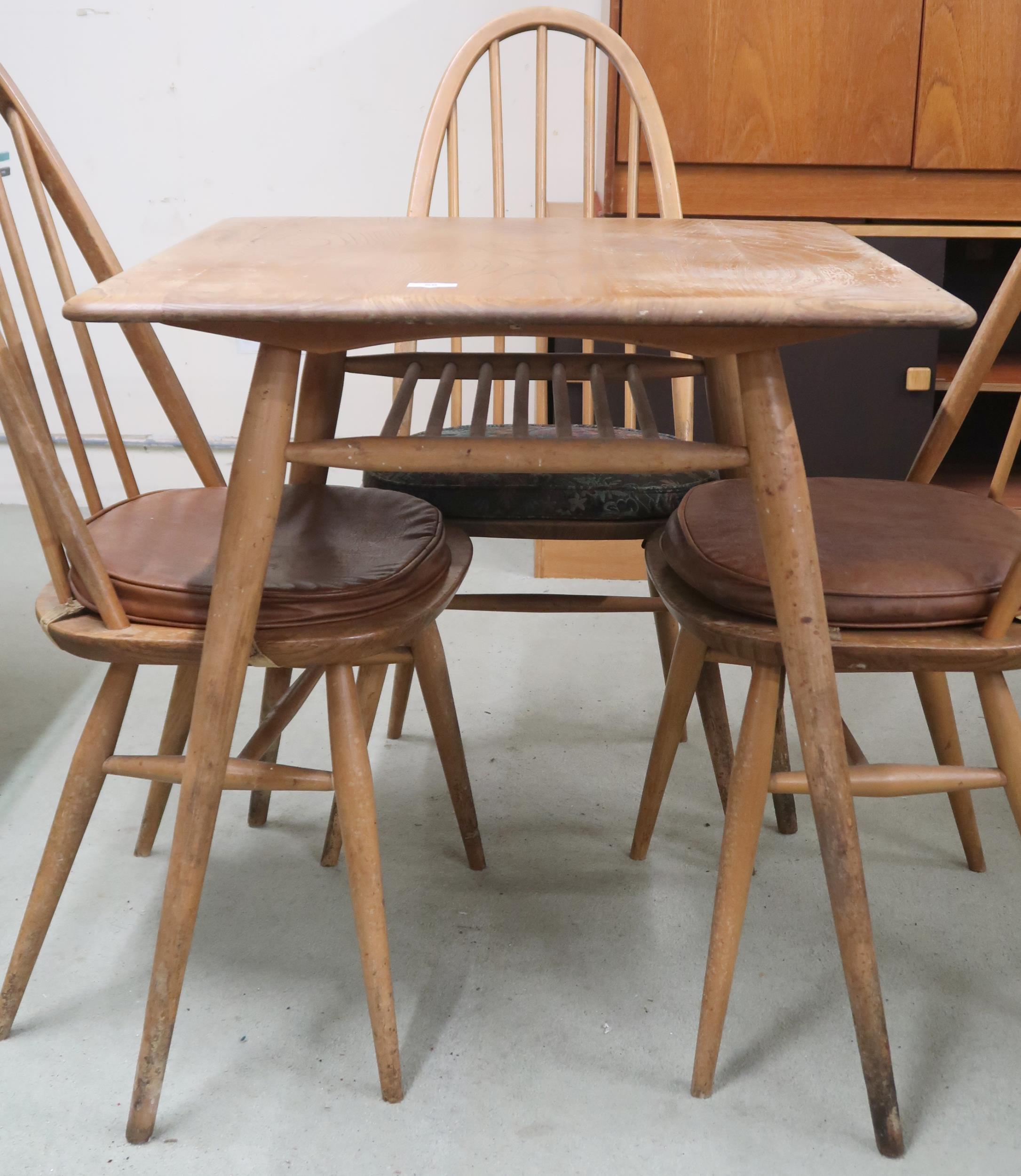 A mid 20th century Ercol elm and beech model 395 table with square top over railed lower tier on - Image 2 of 3