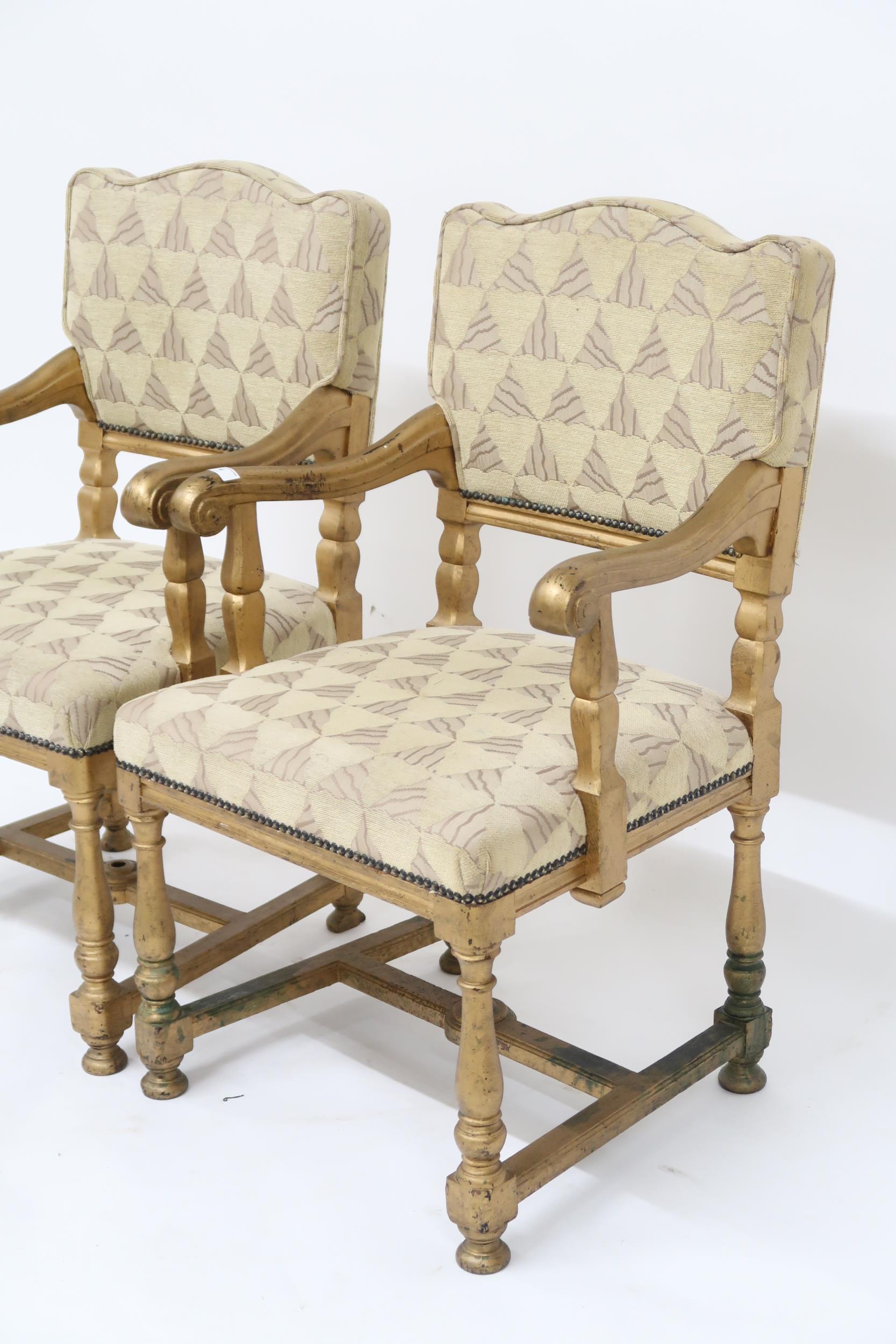 A pair of early 20th century gilt framed theatre seats with beige geometric upholstery, scrolled - Image 2 of 2