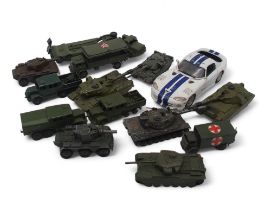 A collection of model military vehicles, largely by Dinky, together with a further selection of