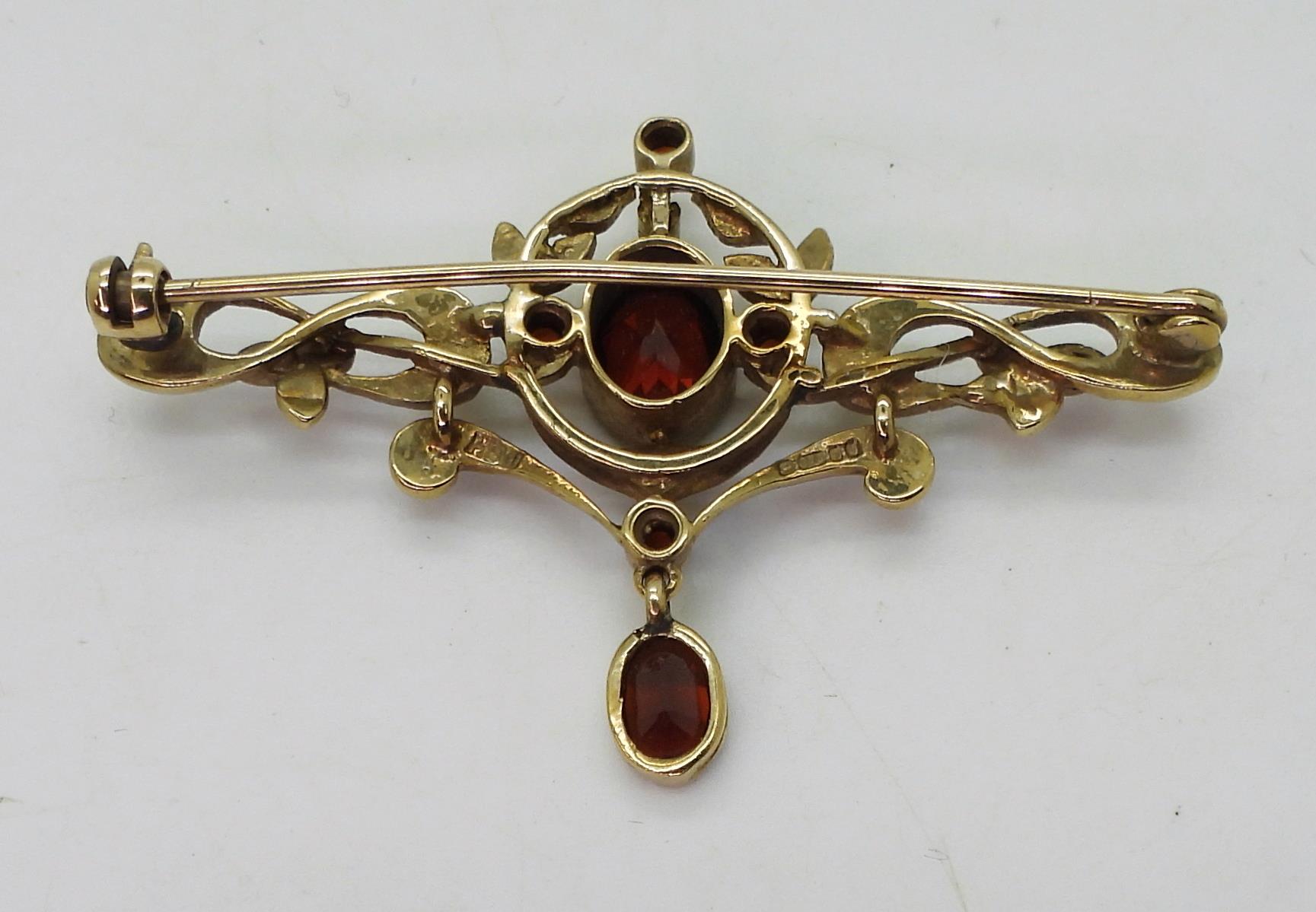 A 9ct gold garnet and pearl Art Nouveau style brooch, length 5cm, weight 5.5gms Condition Report: - Image 3 of 4