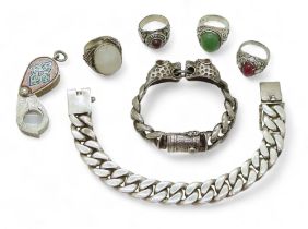 A white metal curb chain bracelet with leopard's head finials, a further example both stamped 925, a