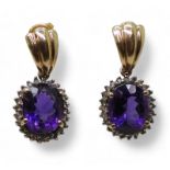 A pair of 9ct gold amethyst and clear gem set earrings, weight 6.1gms Condition Report:Available