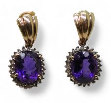 A pair of 9ct gold amethyst and clear gem set earrings, weight 6.1gms Condition Report:Available