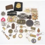 A collection of novelty American sheriff and police badges, Western-style belt buckles etc.,