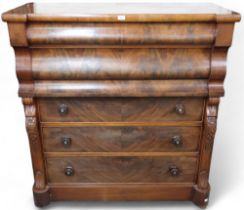 A Victorian mahogany and walnut veneered Ogee chest of drawers with two long ogee frieze drawers