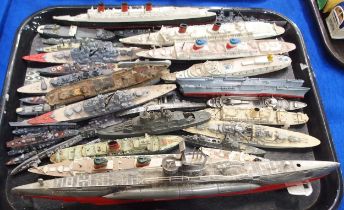 A collection of model ocean liners and military vessels, including the Queen Elizabeth, Queen