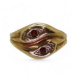 A 9ct gold snake ring the heads set with garnets, hallmarked London 1968, size V1/2, weight 5.9gms