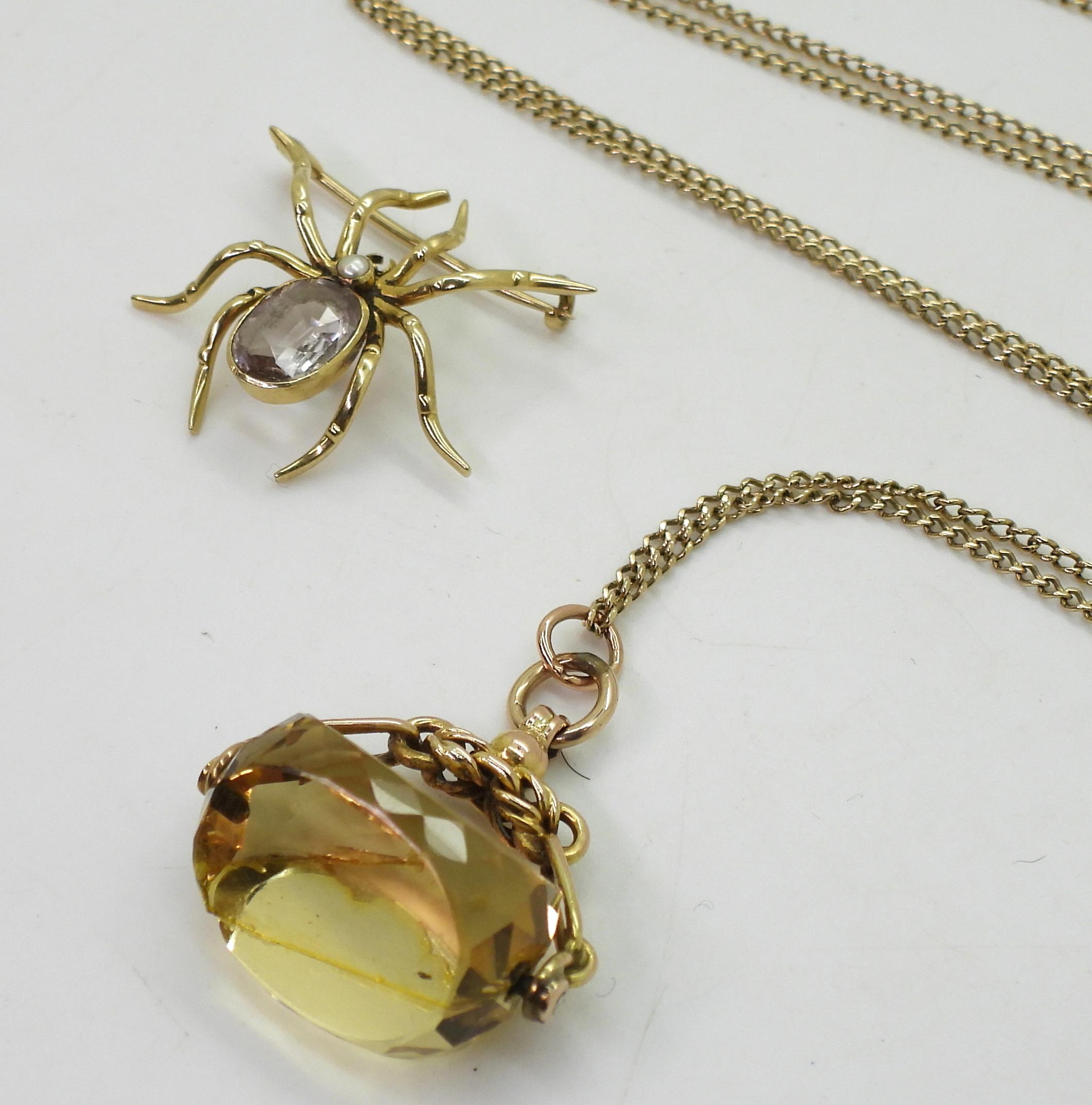 A yellow metal amethyst spider brooch, together with a 9ct gold citrine fob seal (af) and 68cm - Image 3 of 4