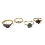 Four 9ct gold rings, amethyst and cz size N, blue topaz and cz, size M1/2, garnet size K1/2, and