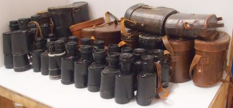 A quantity of leather-cased vintage binoculars, with manufacturers to include Barr & Stroud,