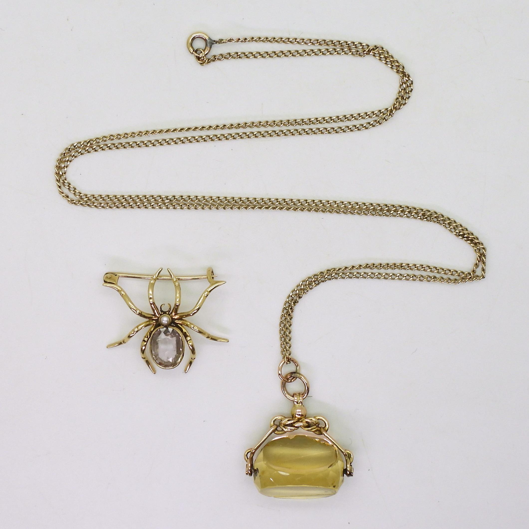 A yellow metal amethyst spider brooch, together with a 9ct gold citrine fob seal (af) and 68cm - Image 2 of 4