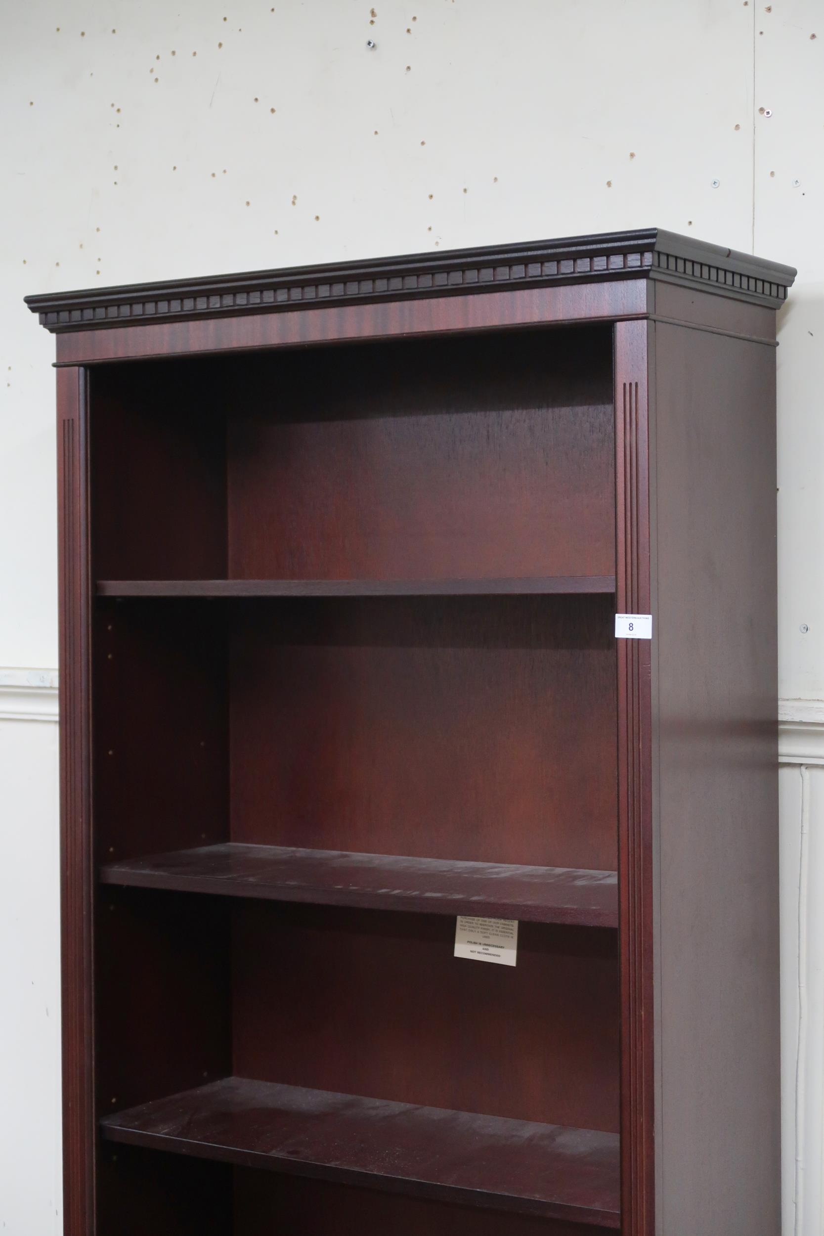 A 20th century mahogany veneered open bookcase with dentil cornice over five adjustable shelves on - Image 2 of 2