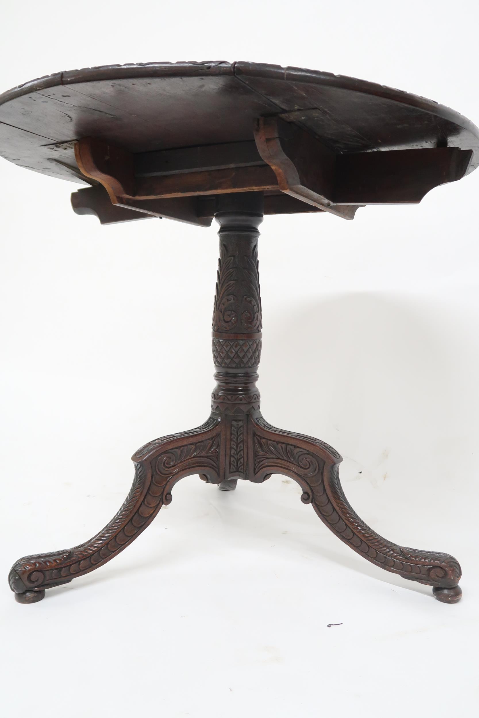 A 19th century stained oak Jacobean style carved drop end table with extensively carved circular top - Image 3 of 3