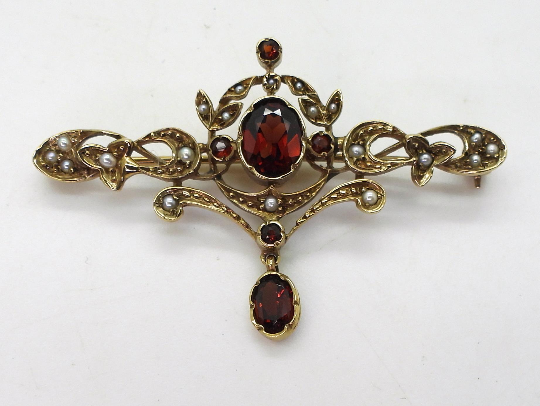 A 9ct gold garnet and pearl Art Nouveau style brooch, length 5cm, weight 5.5gms Condition Report: - Image 2 of 4