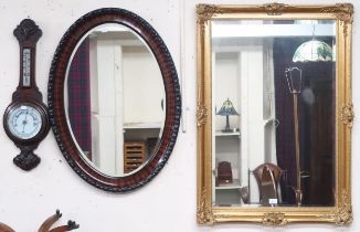 A lot comprising an oak aneroid Barometer/thermometer, Victorian oval wall mirror and a contemporary