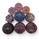 A collection of John Deacons millefiori paperweights one dated 2011, two with EIIR cane, two with St