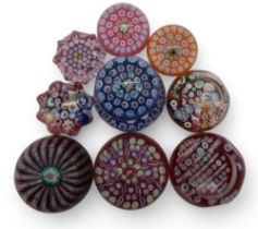 A collection of John Deacons millefiori paperweights one dated 2011, two with EIIR cane, two with St