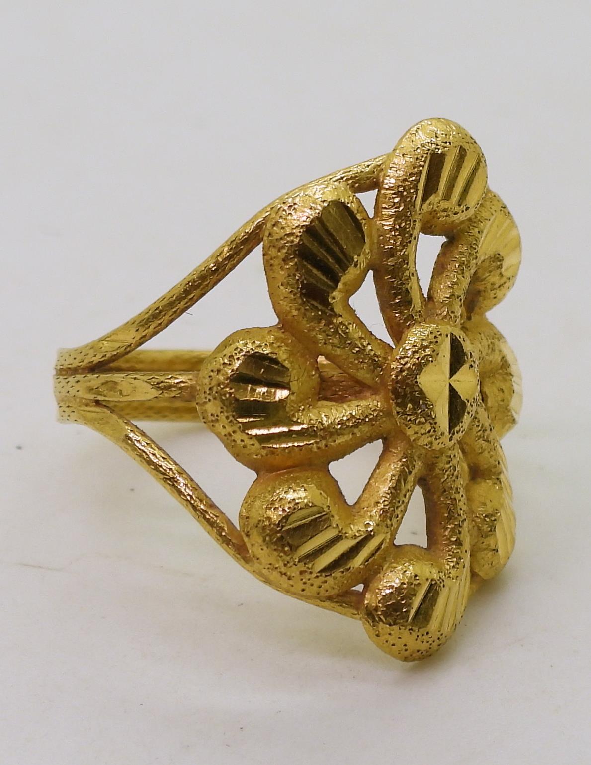 A Bright yellow metal flower shaped ring, stamped 96.5%, size O1/2, weight 3.8gms Condition Report: - Image 3 of 4